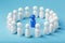 A team of white people stands around and listens to the leader`s blue leader. The concept of the leader of the business team