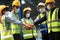 Team workers wear protective face masks for safety industrial factory.