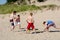 Team of young men play spike ball