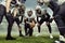 Teammates. Team of male american football players before sport match at stadium over cloudy sky background with