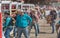 Teams of cowboys prepare to release horses into arena for Wild Horse Race at stampede