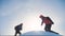 Teamwork business concept victory slow motion video. Two tourist hikers success win winter reached the top of the