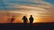 Teamwork business travel concept. two tourists walking lifestyle silhouette go on the road nature sunset sunlight