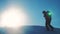 Teamwork business winter adventure. men tourists climbing walking top mountains rocks peak group team sunlight