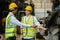 Teamwork engineers, Worker wear uniform and helmet talking in warehouse.