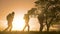 Teamwork. Group men silhouette hikers with backpacks walk along trail next go travel to the mountains up top near the