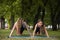 Teamwork gymnastics. Active stretching outdoors