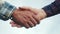 Teamwork handshake concept. two people shake hands shaking hands. different skin colors shake hands conclude a business