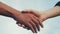 Teamwork handshake concept. Two people shake hands shaking hands. Different skin colours shake hands conclude a business