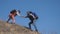 Teamwork help business travel concept lifestyle couple man and woman. Of tourists lends a helping hand climb the cliffs