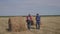 Teamwork lifestyle agriculture smart farming concept. two men farmers workers walking studying haystack in field on