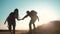 Teamwork Silhouette of helping hand hikers help business travel silhouette concept. happy family couple group of