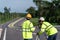 Teamwork of surveyor engineers with equipment on road construction site, Civil Engineers, Surveyor equipment