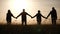 teamwork. team community hold hands together silhouette at business sunset unity. group of people hands. teamwork a