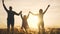 teamwork. team happy family community holding hands together silhouette at sunset unity. group of people hands. teamwork