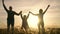 teamwork. team happy family community holding hands together silhouette at sunset unity. group of people hands. teamwork