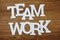 Teamwork text letters alphabet Top view on wooden background