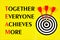 Teamwork-together everyone achieves more-lettering text on the background of a dartboard target. The concept of effective