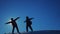 Teamwork travel travel .two men tourist climbers silhouettes playing two men tourist climbers rising up hands lifestyle