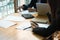 Teamwork.young businesswomen sitting at table look at paper and