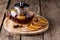 Teapot of Black Tea with Dried Oranges and Berries on the Wooden Tray Dried Citrus Wooden Background Hot Winter or Autumn Beverage