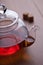 Teapot with black tea and sugar cubes