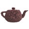 Teapot of coffee beans