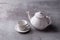 Teapot creamer, Cup and saucer on Cement Board.