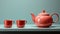 A teapot and a cup on a table