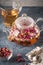 Teapot with detox drink from flower buds dry red pink rose tea w