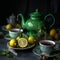 Teapot Filled with Hot Green Tea and Tea Cups