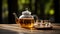 teapot and glass containing tea water on the table