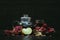teapot and glass with pomegranate juice and lemons on a