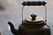 Teapot - Golden Brass Bronze Tea Pot - With Blue and White Enamel Handle Abstract Mood Background