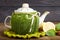 Teapot with handmade knitted cover, lemon, cinnamon, mint