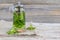 A teapot with mint tea and a mug on a wooden background.A soothing, healthy drink.Summer tea .copy space