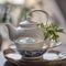 A teapot pouring a stream of herbal tea into an elegant porcelain cup1