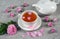 Teapot and tea cup with petals