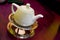 Teapot on trivet in warm light