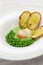 Tear peas with poached egg, spanish basque cuisine