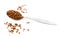 Teaspoon of instant coffee, some granules spilled