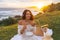 Teatime Boho Breakfast Picnic with Romantic Woman in White Dress