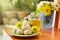 Teatime with Chinese pastry and tea and flower on a orange chair