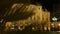 Teatro Arriaga opera house seen through palm tree, night life in Bilbao, Spain