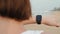 Tech smart watch smartwatch, active woman start run and go with application wearing activity tracker bracelet on wrist