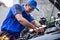 Techinician help customer fixing his car