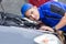 Techinician help customer fixing his car