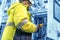 An technical engineer performs a measurement in a control cabinet