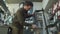 Technical expertise taking care bicycle shop. Attractive mechanic is fixing customer\'s bicycle at his own workshop