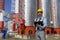 Technical Manager, Engineer and Power Plant Worker Working in front of Industrial Chimneys